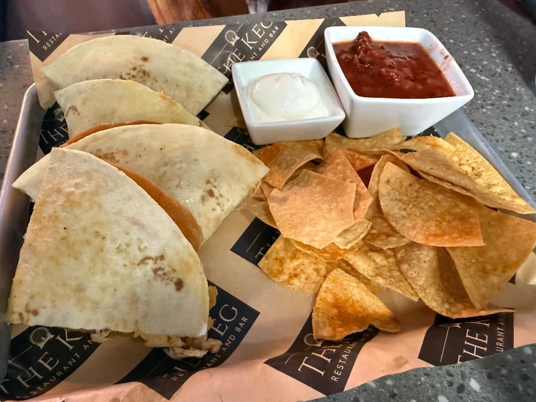 Chicken quesadilla wedges with tortilla chips and salsa